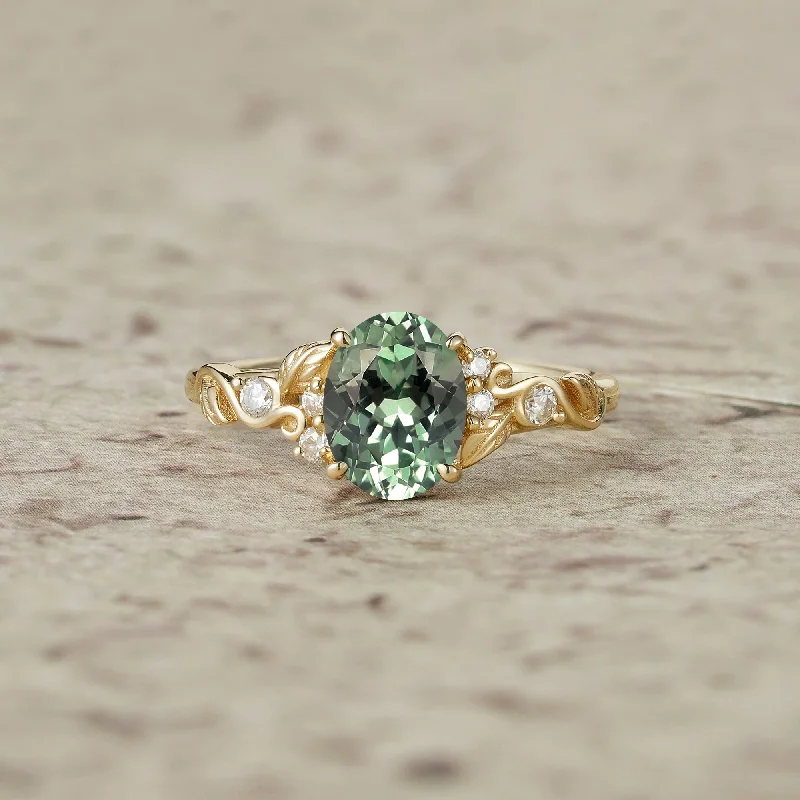 Men's Emerald Engagement Rings with 14K Yellow Gold and Vintage - Style FiligreeNature's Embrace: Oval Cut Green Sapphire Leaf Ring - Lila