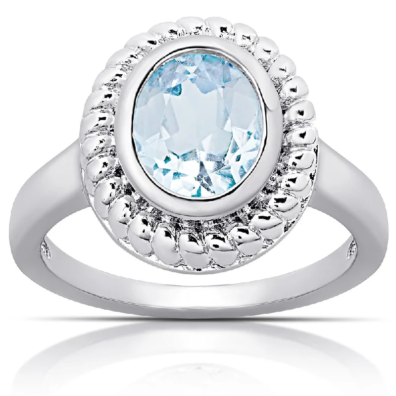 Topaz Gemstone Rings in 10K Gold with a Channel - Set Design for a Contemporary and Durable OptionDolce Giavonna Sterling Silver Blue Topaz Oval Cocktail Ring (Size 7)